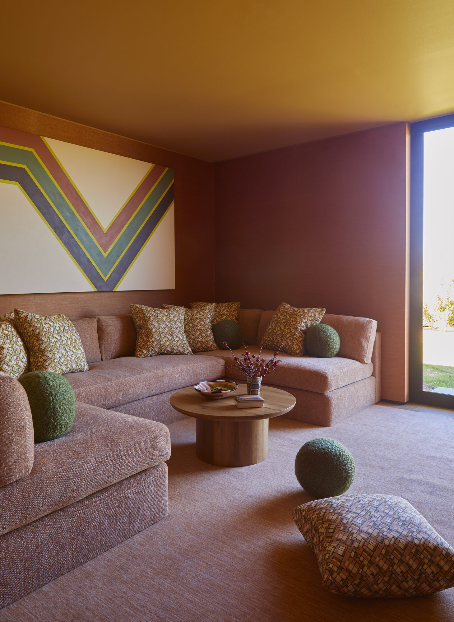 terracotta blush family room with retro art