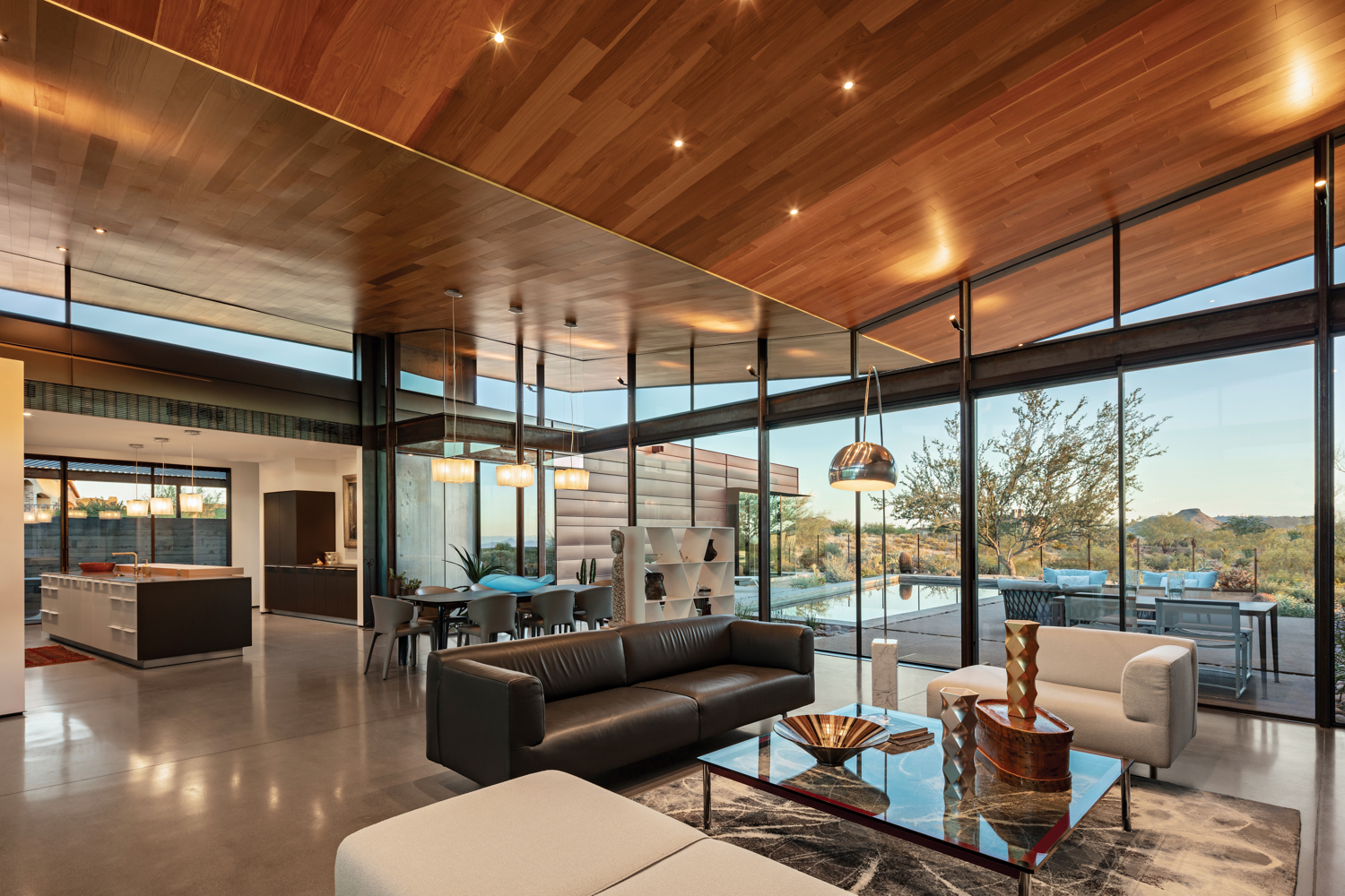 A glass-walled great room with...