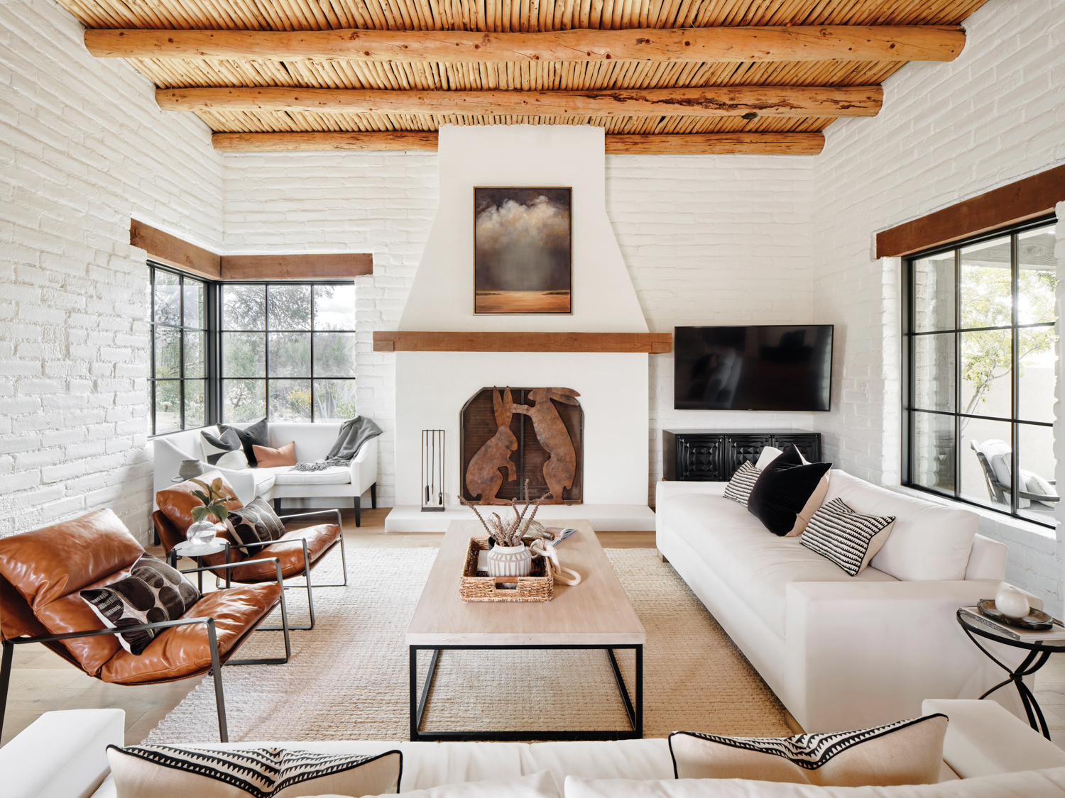 A living room with white...