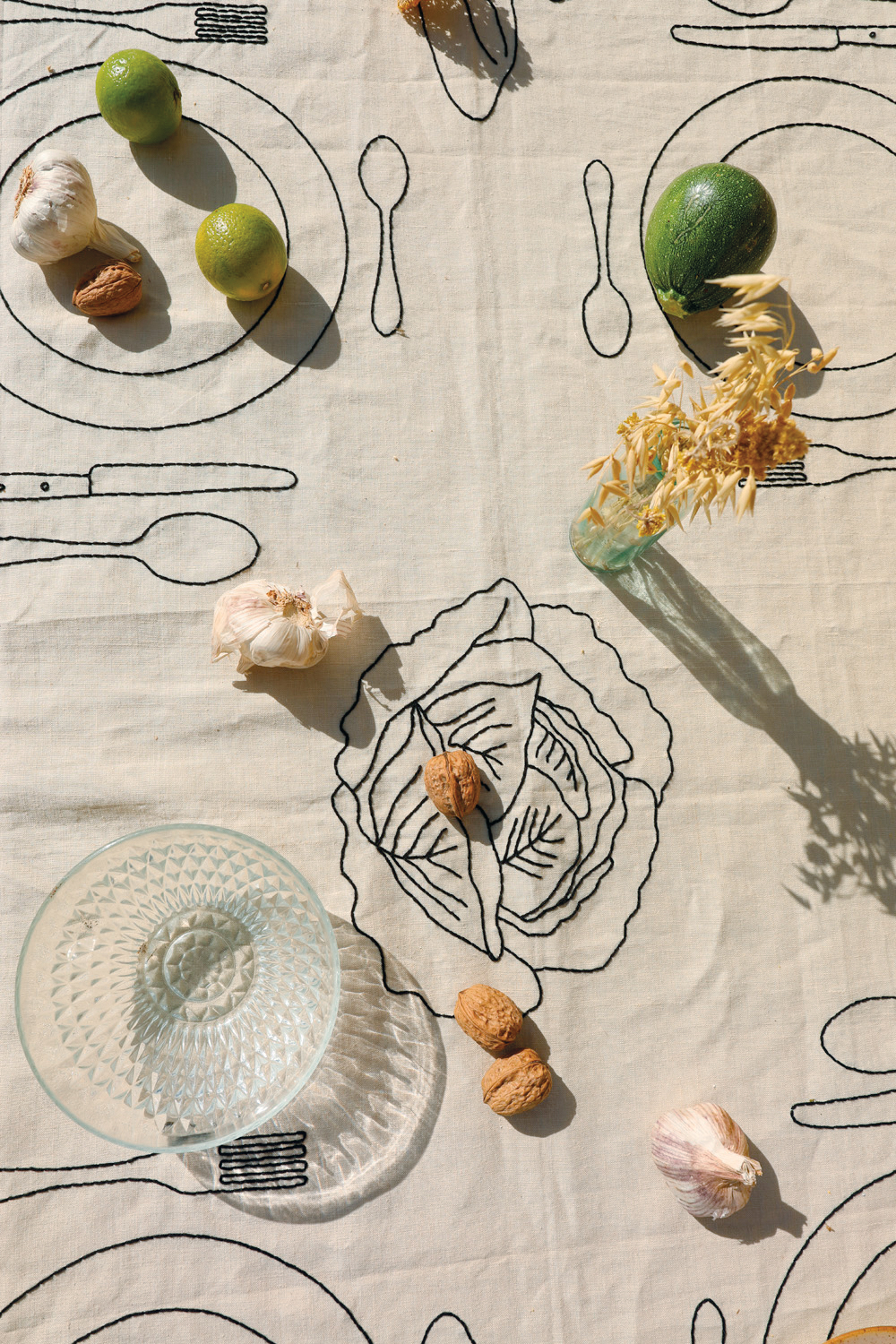 close up of embroidered linens on dining table
