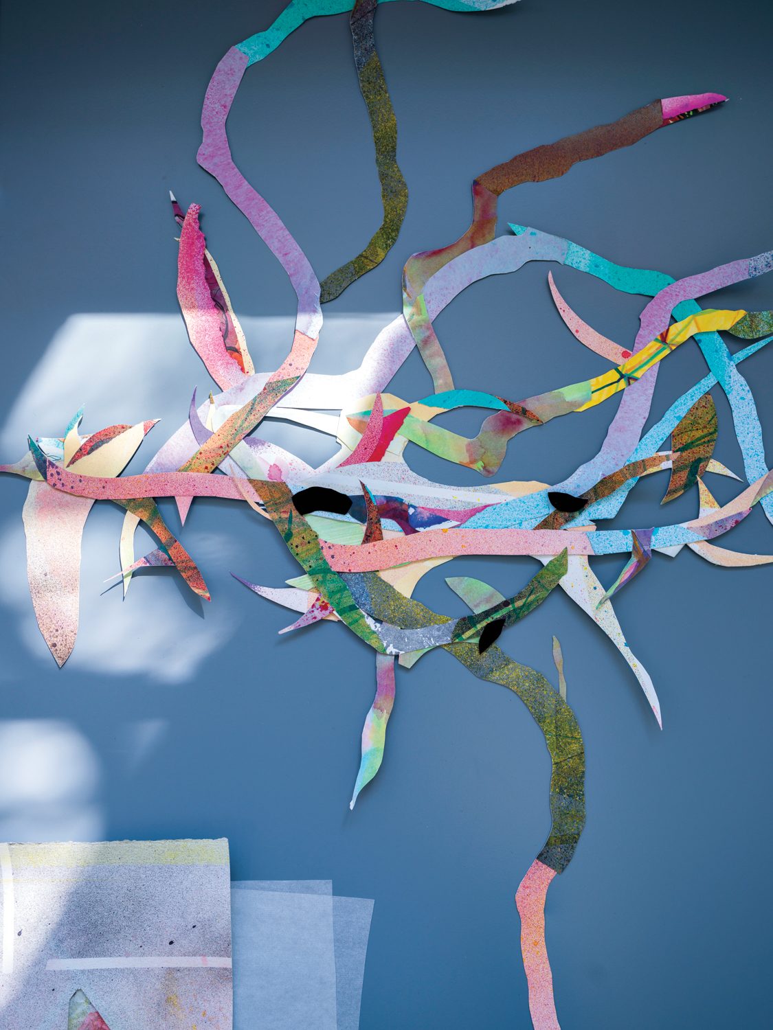 A delicate layering of colored paper that gives the impression of thorns.