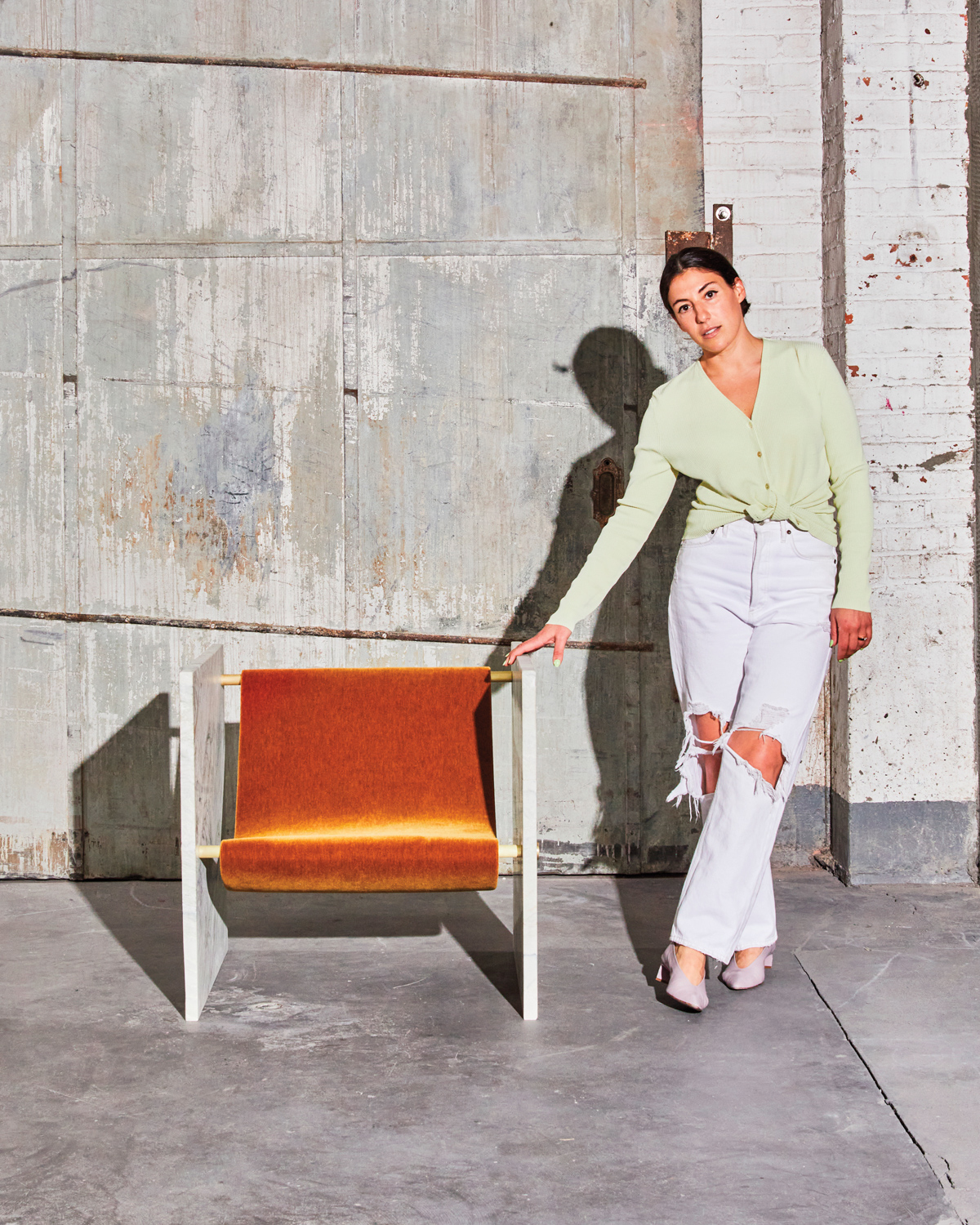 Sleek Adri Chair in a Concrete setting with designer