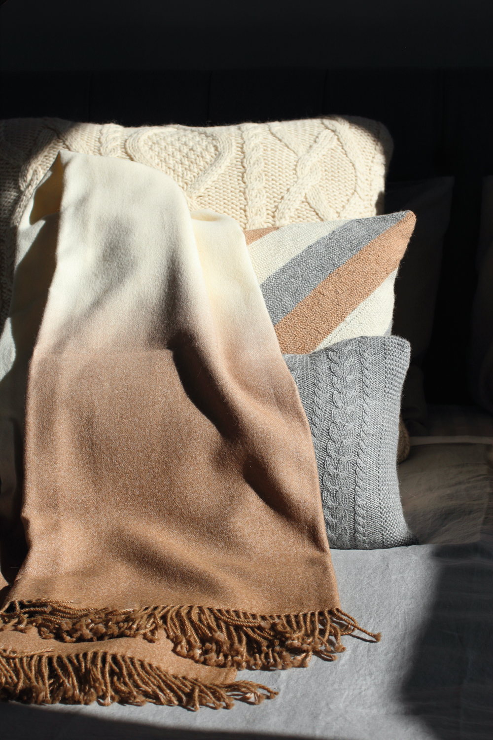 Tan, cream and gray throw and pillow