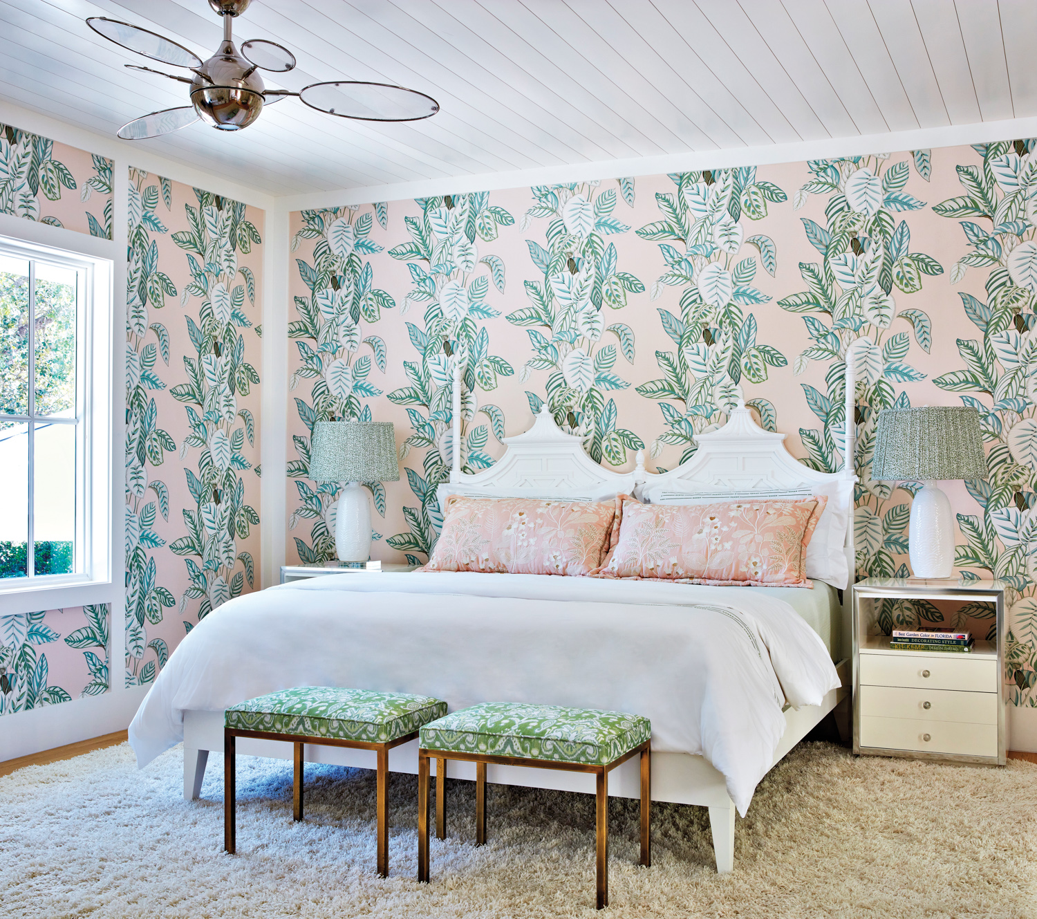bedroom with orchid-patterned pink and...