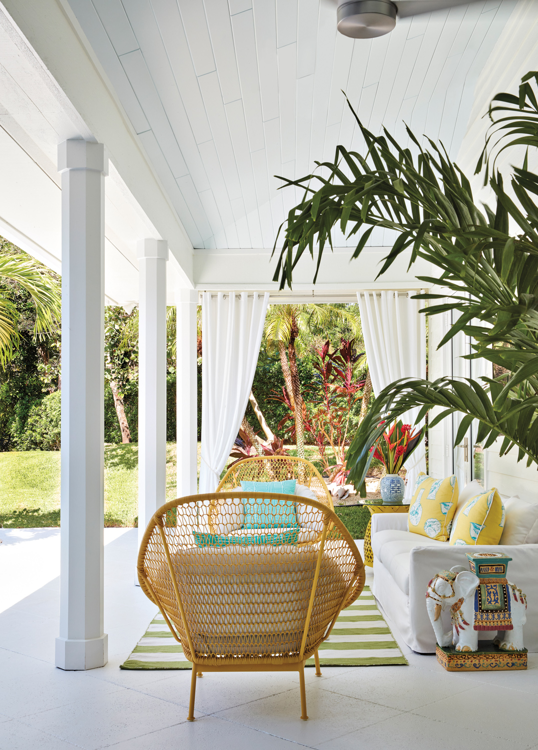 loggia with yellow armchairs, white...