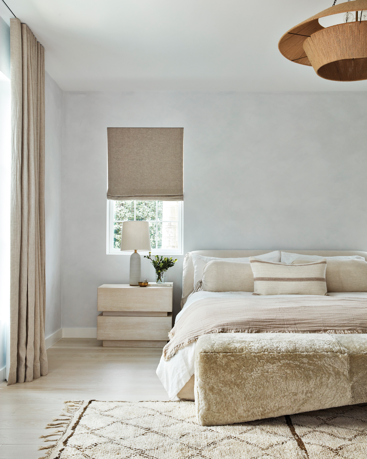 neutral bedroom with low-profile bed,...