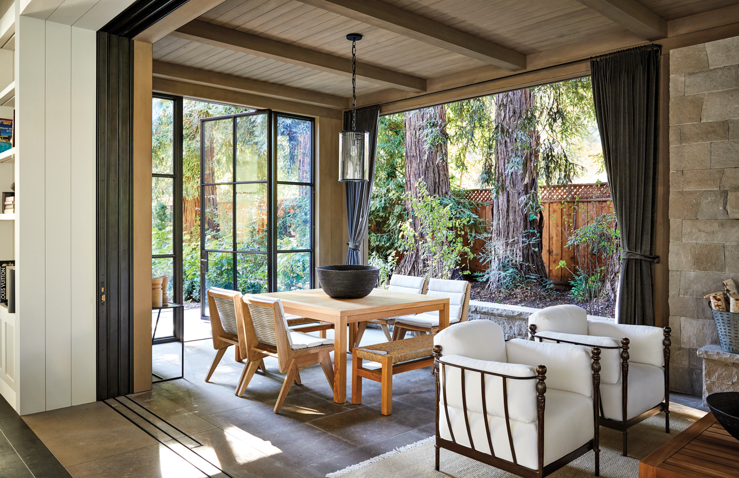 indoor-outdoor dining with teak table and chairs