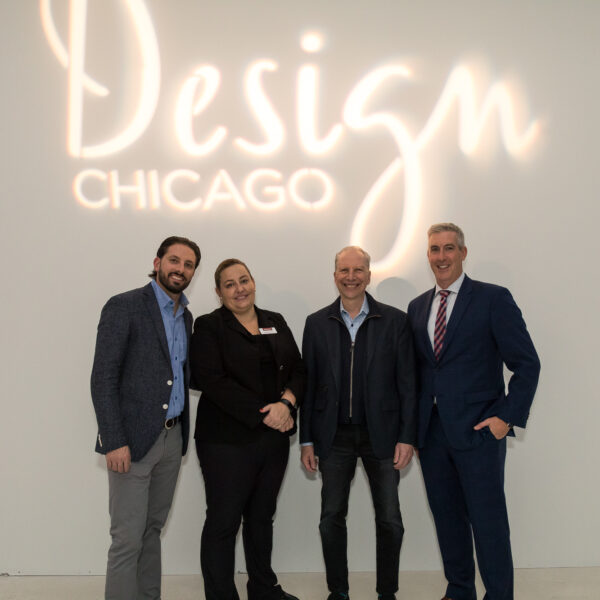 Design Chicago Soiree attendees in front of lit Design Chicago sign