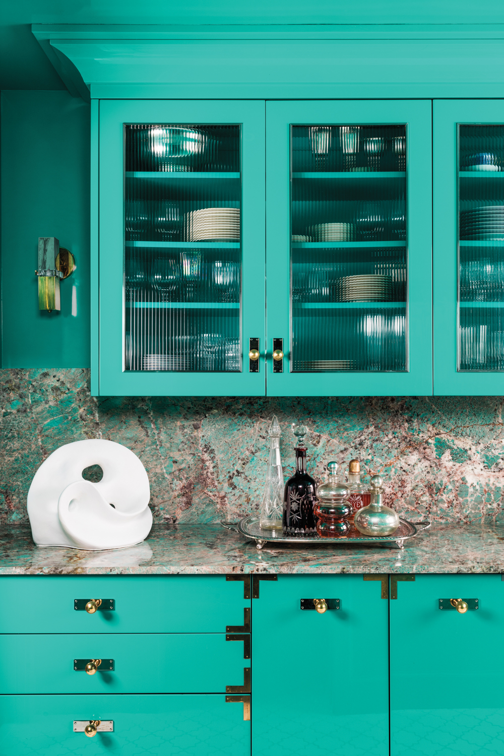 teal bar are with glass cabinets
