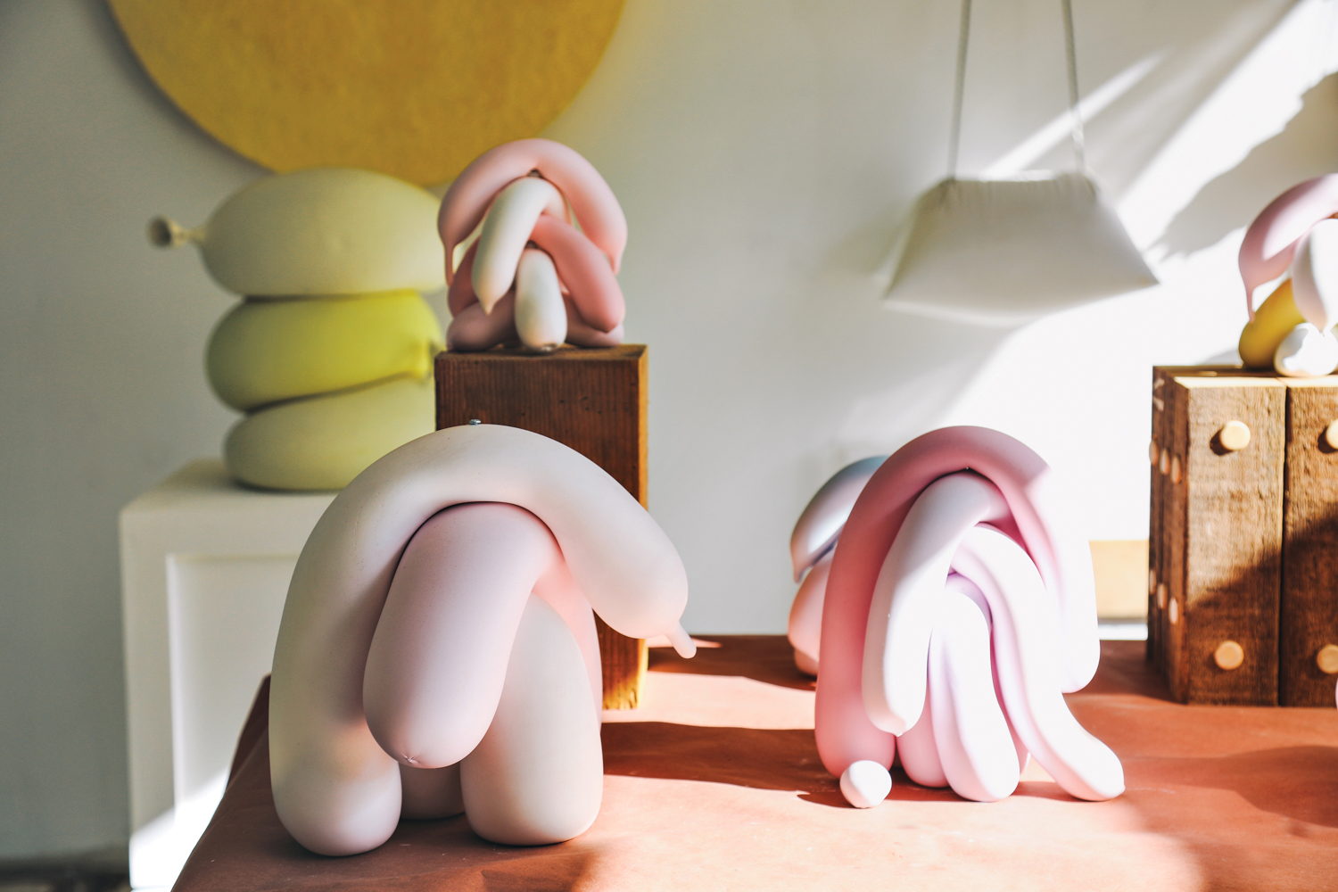 series of cast balloons in slumped statues