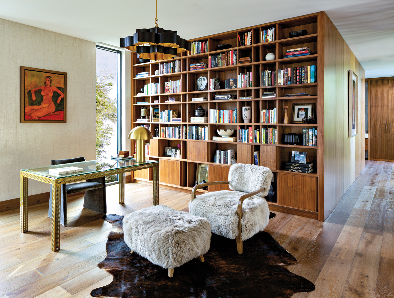 library with walnut bookcase, sculptural...