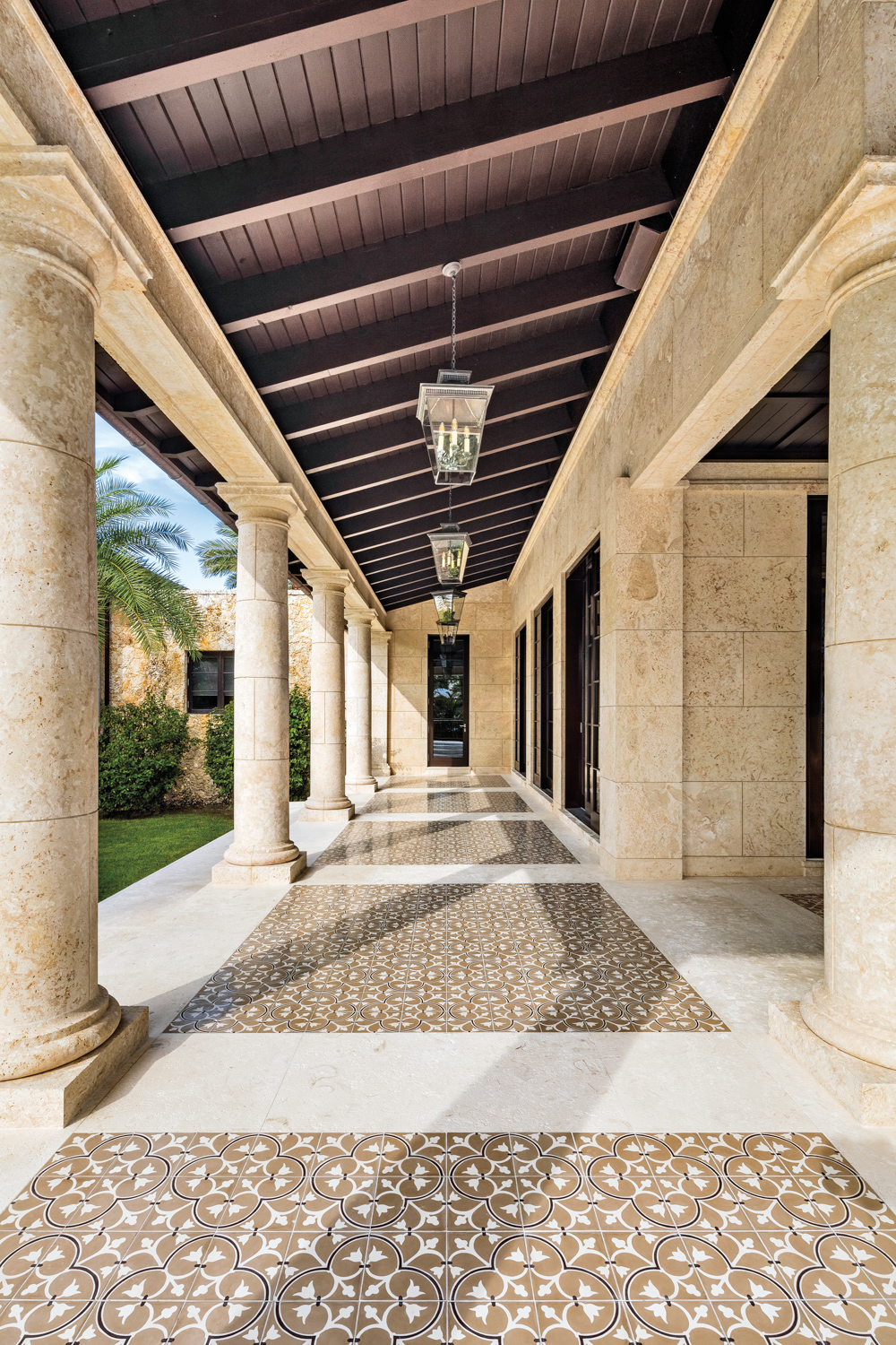 dramatic exterior archways and hall made from coral in miami home
