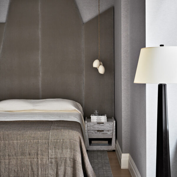 Lean Into The Posh Palette Of Neutrals Of This Tribeca Pied-à-Terre bedroom with cluster pendants and custom headboard
