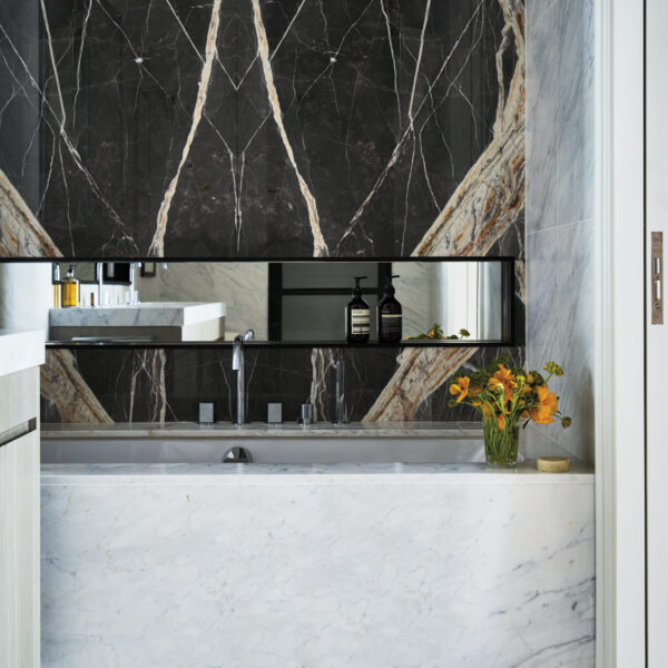 Lean Into The Posh Palette Of Neutrals Of This Tribeca Pied-à-Terre bathroom with white and black Calacatta marble