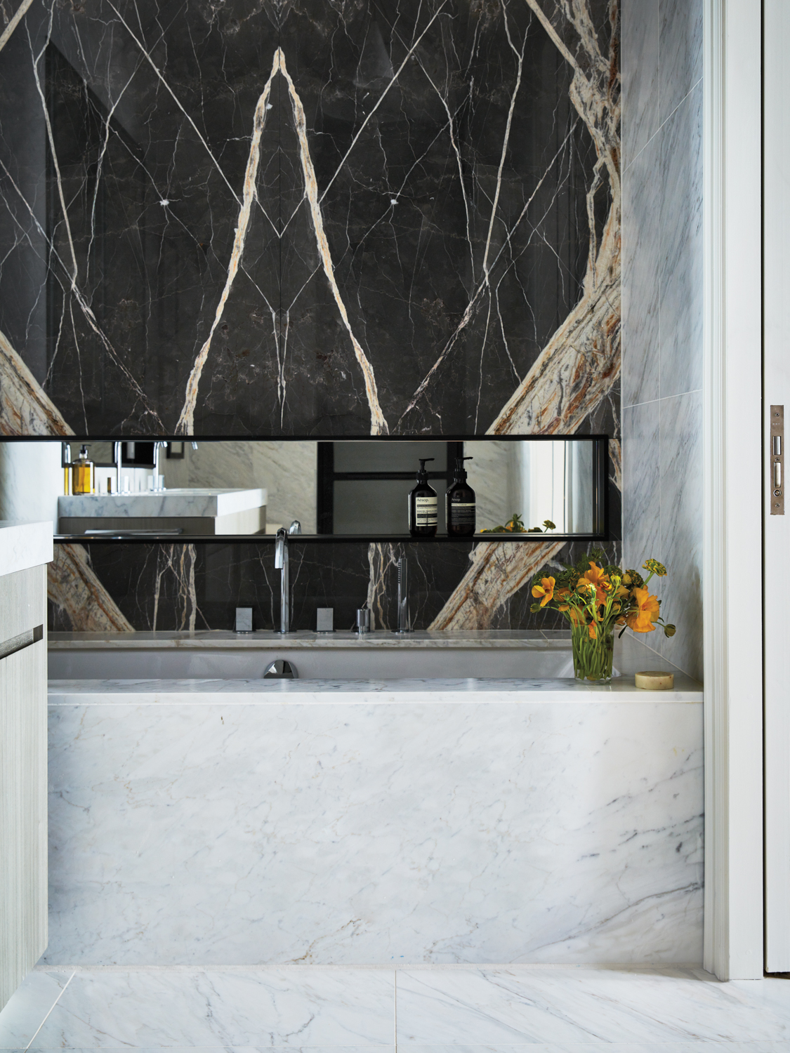 bathroom with white and black Calacatta marble