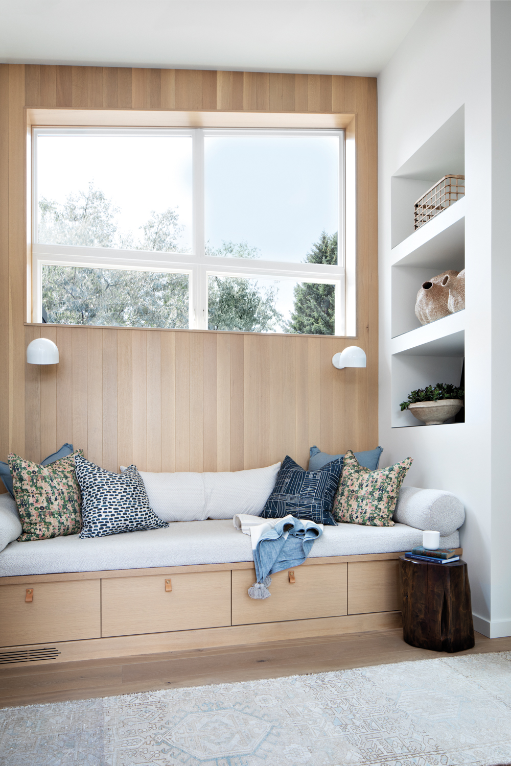 modern wood-paneled reading nook featuring custom cushioning