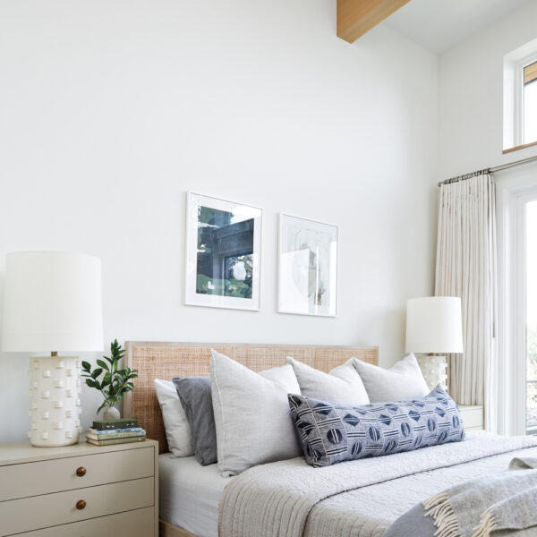See How Classic Cottages Inspired This Modern Oregon Home modern bedroom features shades of white, blue and gray