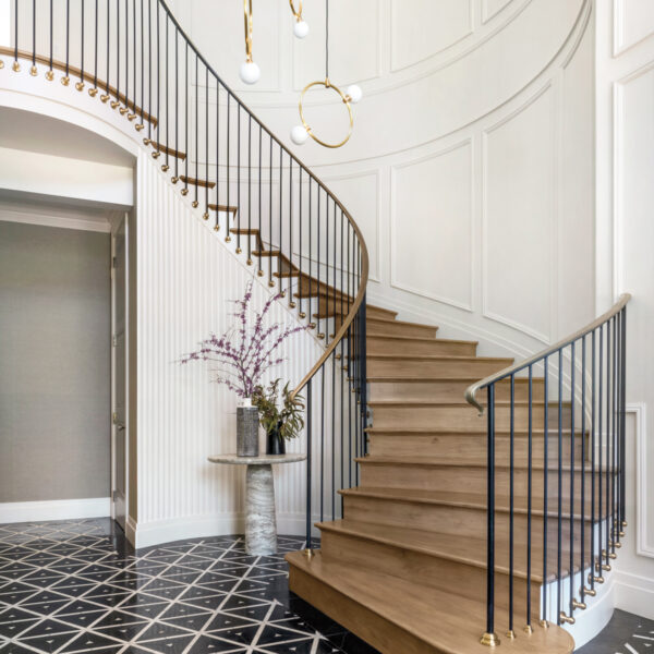 Inside A Soirée-Ready Bay Area Home With A Dazzling Entryway entrance hall with spiraling staircase with brass railing