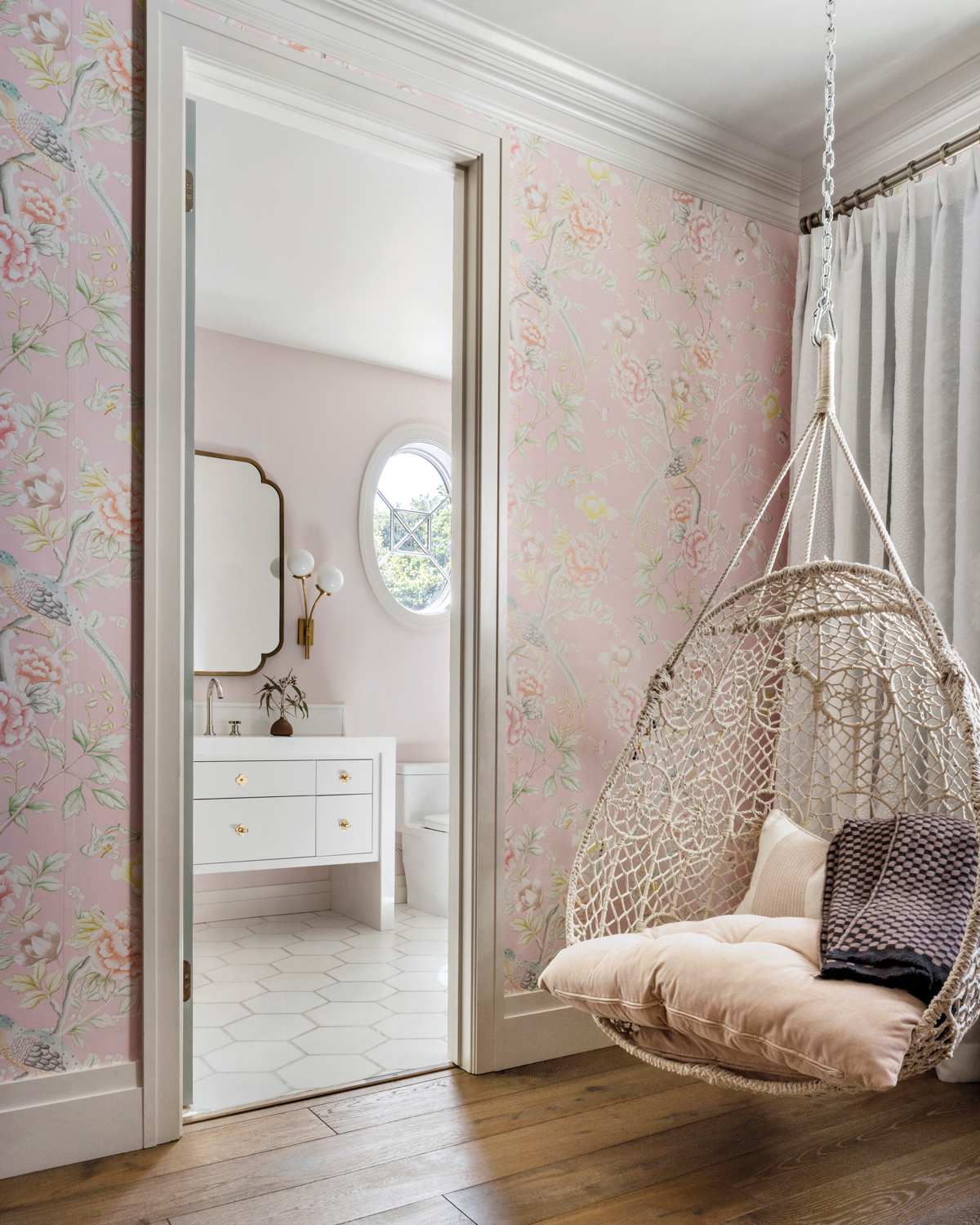 The daughter's room features a hanging chair.