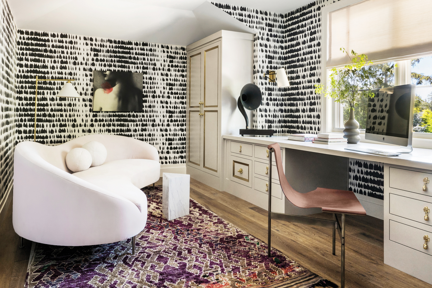 The wife's office features a black-and-white wallpaper with a raindrop pattern.