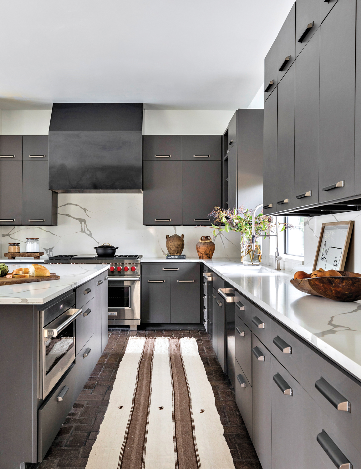 sleek kitchen with black cabinetry...