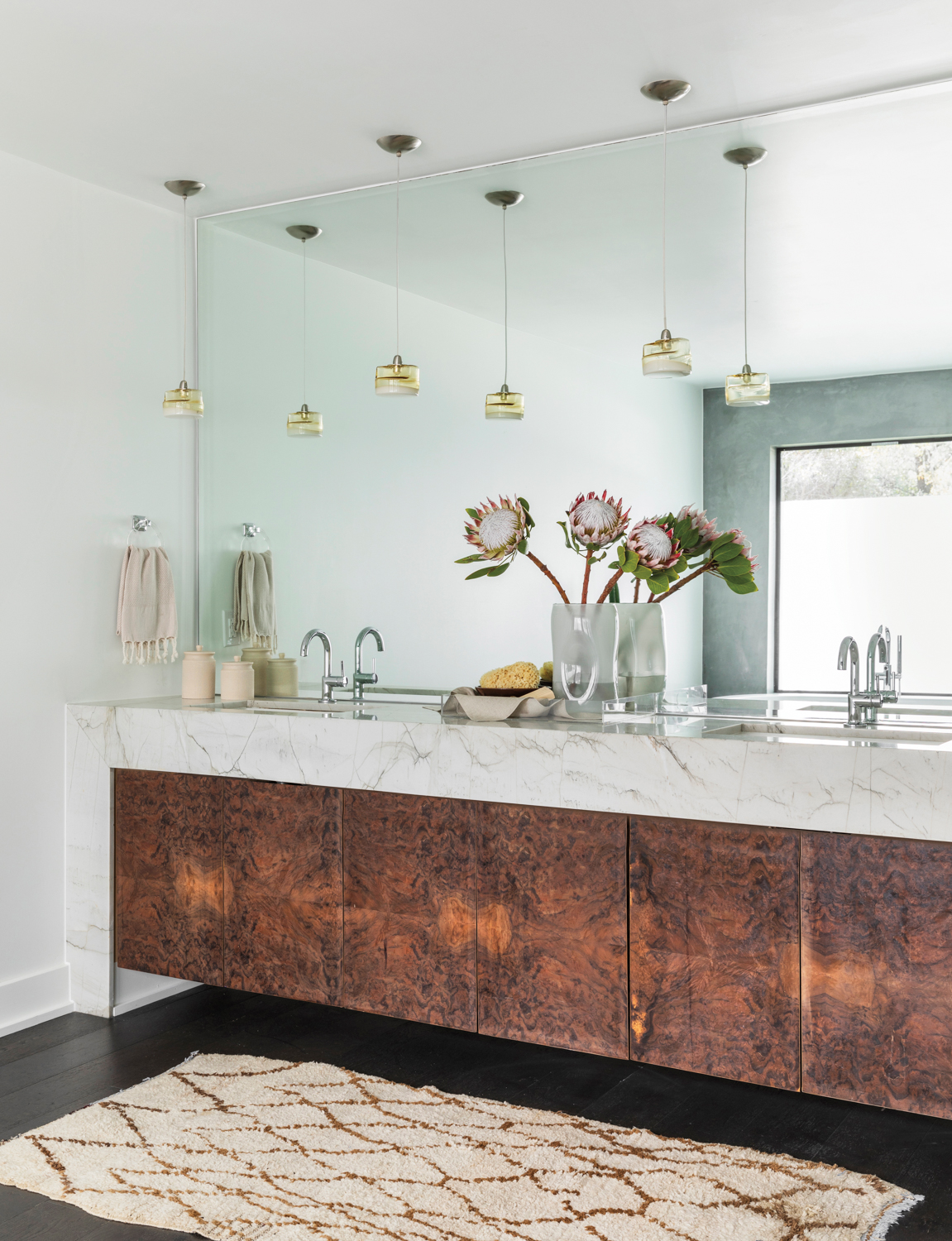 bathroom with burl wood cabinetry