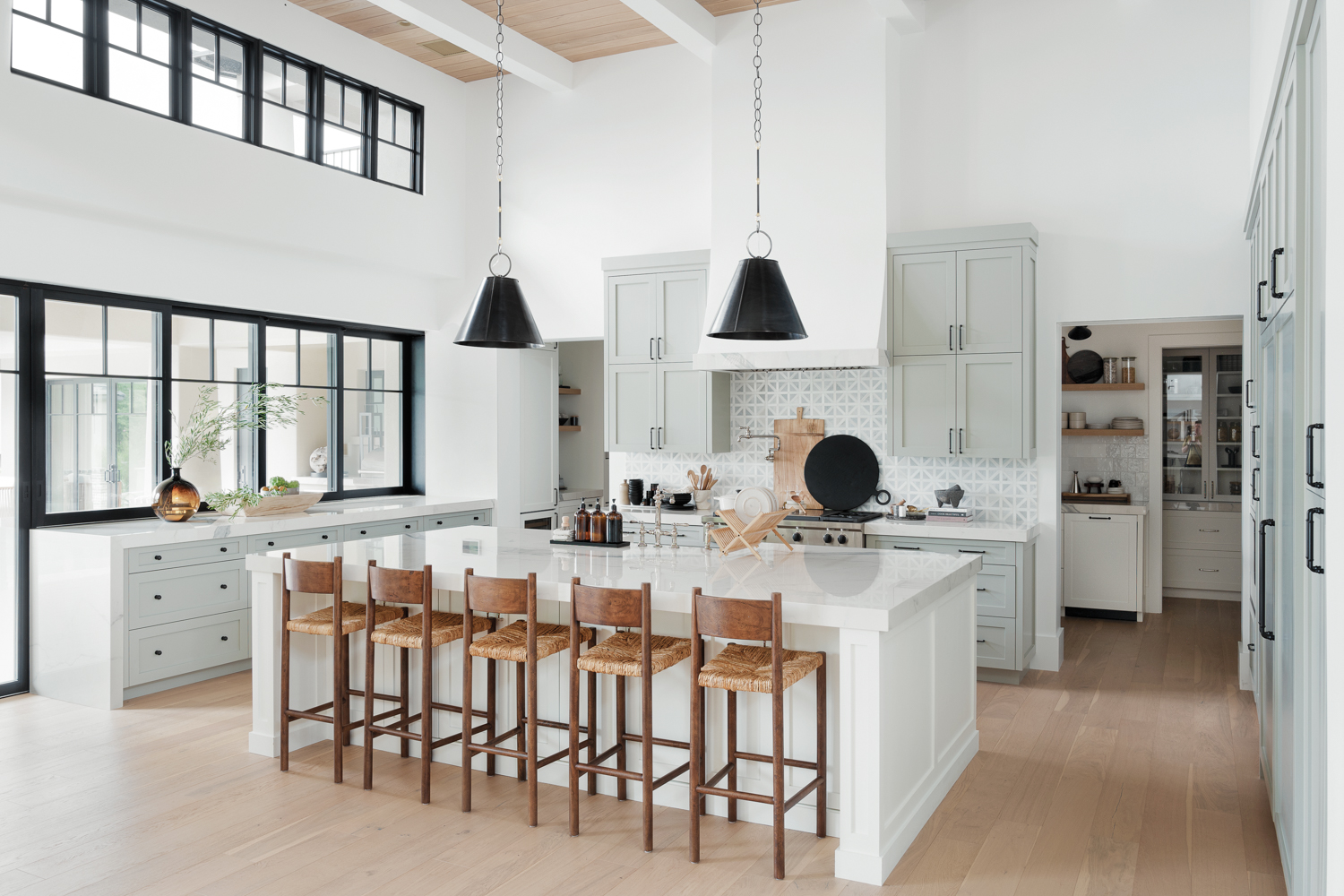 A large white kitchen with...