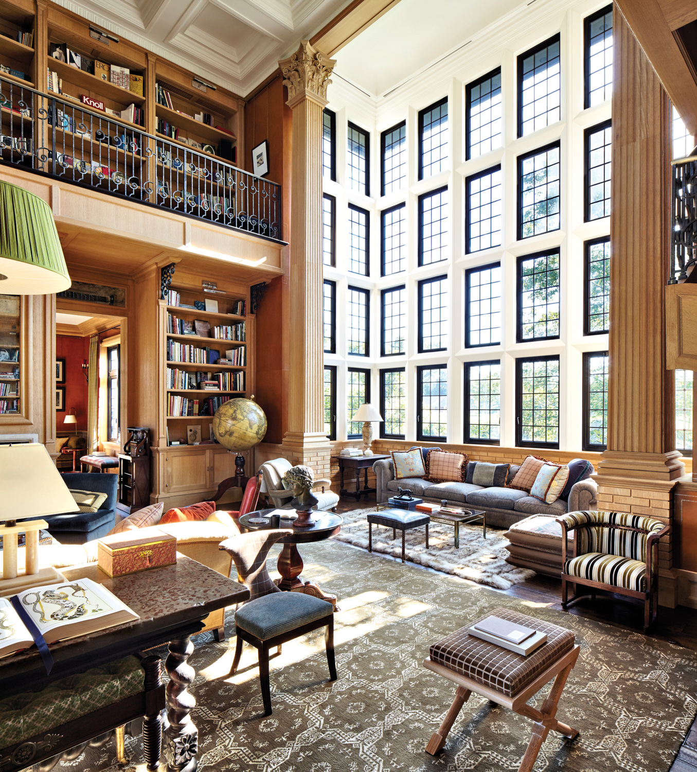 traditional two-story library room with grand windows