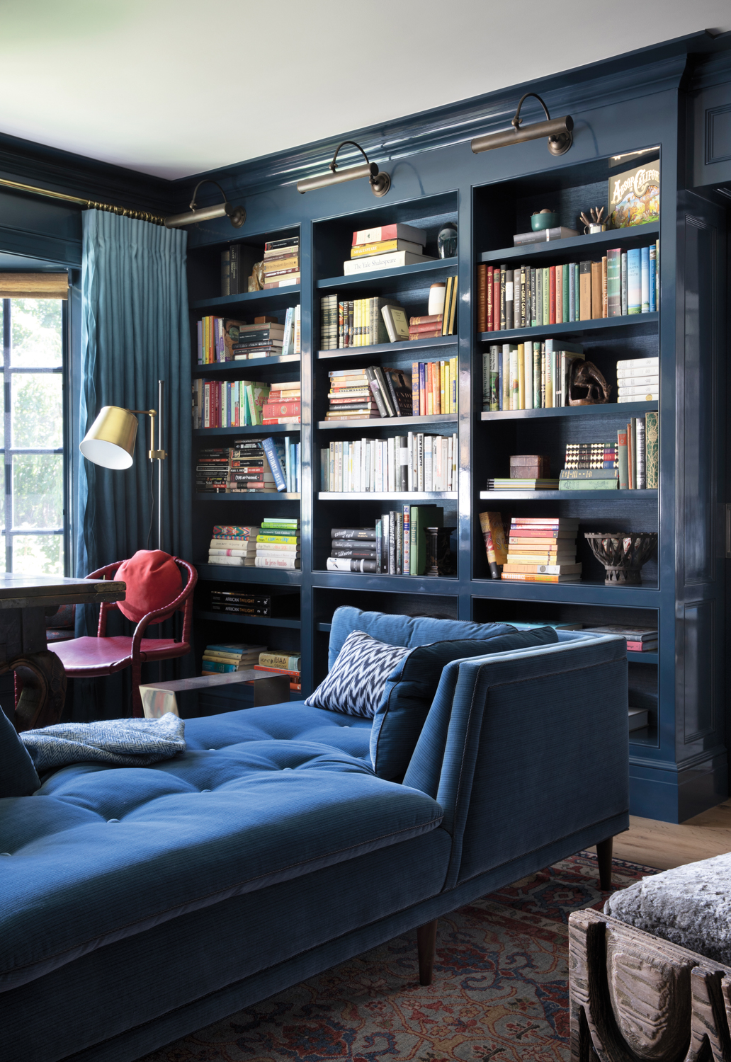 blue library with blue chaise lounge seating 