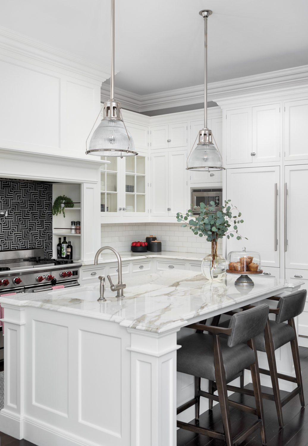 A white kitchen with a...