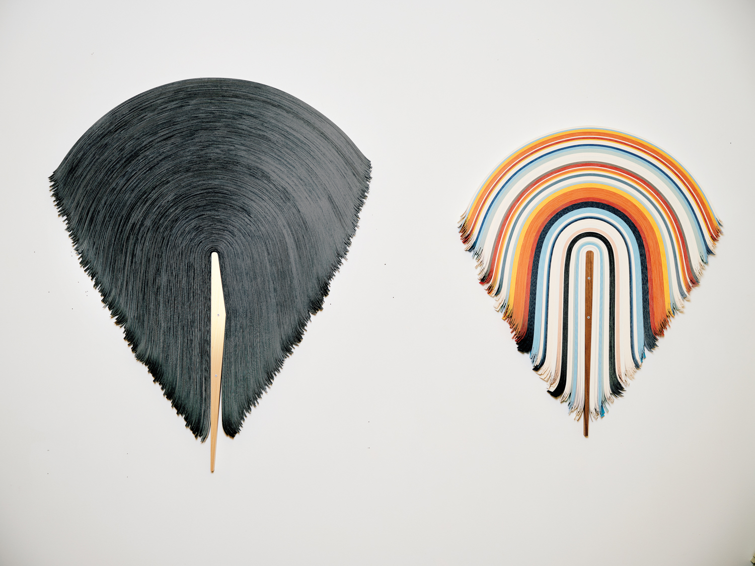 draped vinyl sculptures hung on wall
