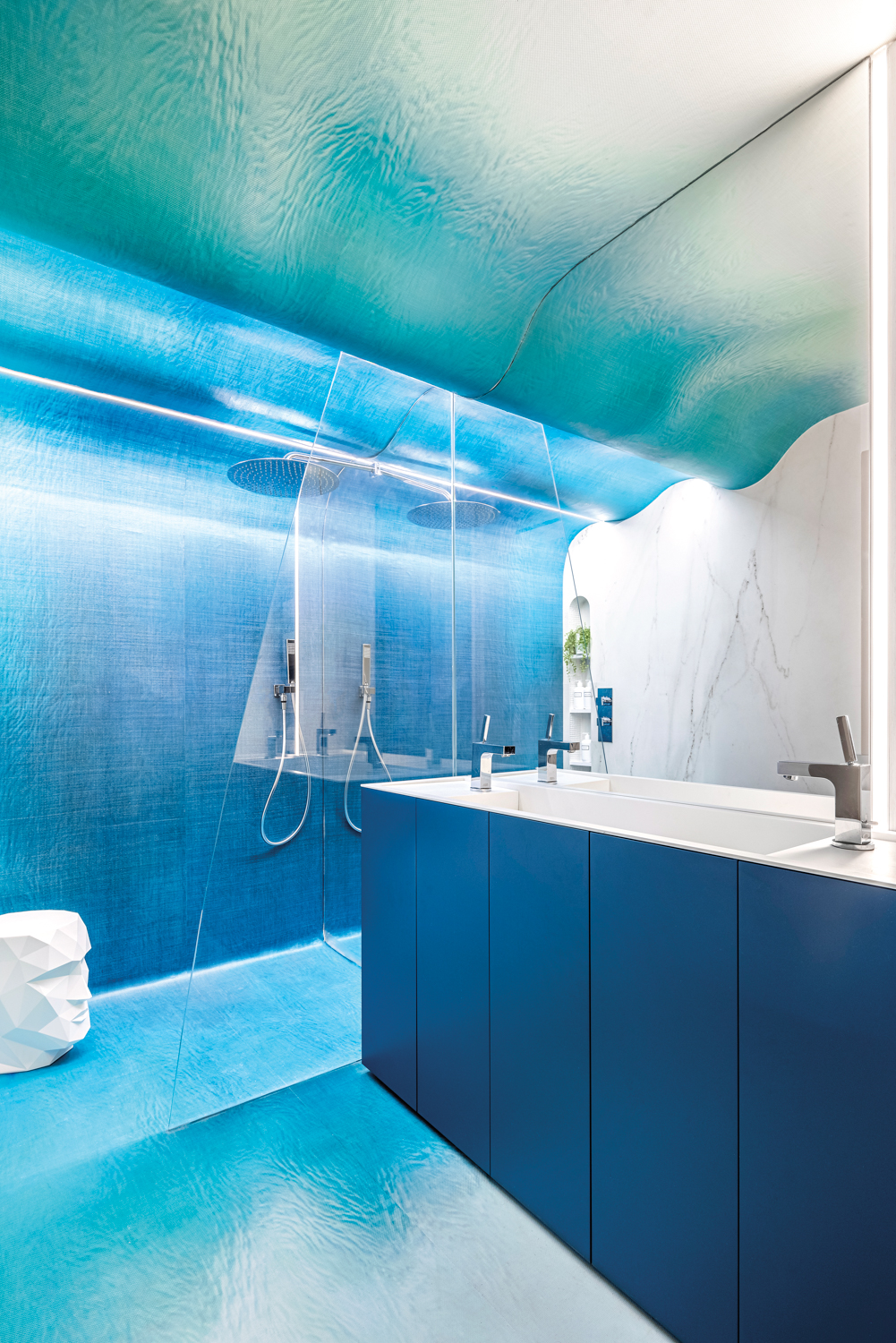 bathroom with blue ombre wallpaper,...