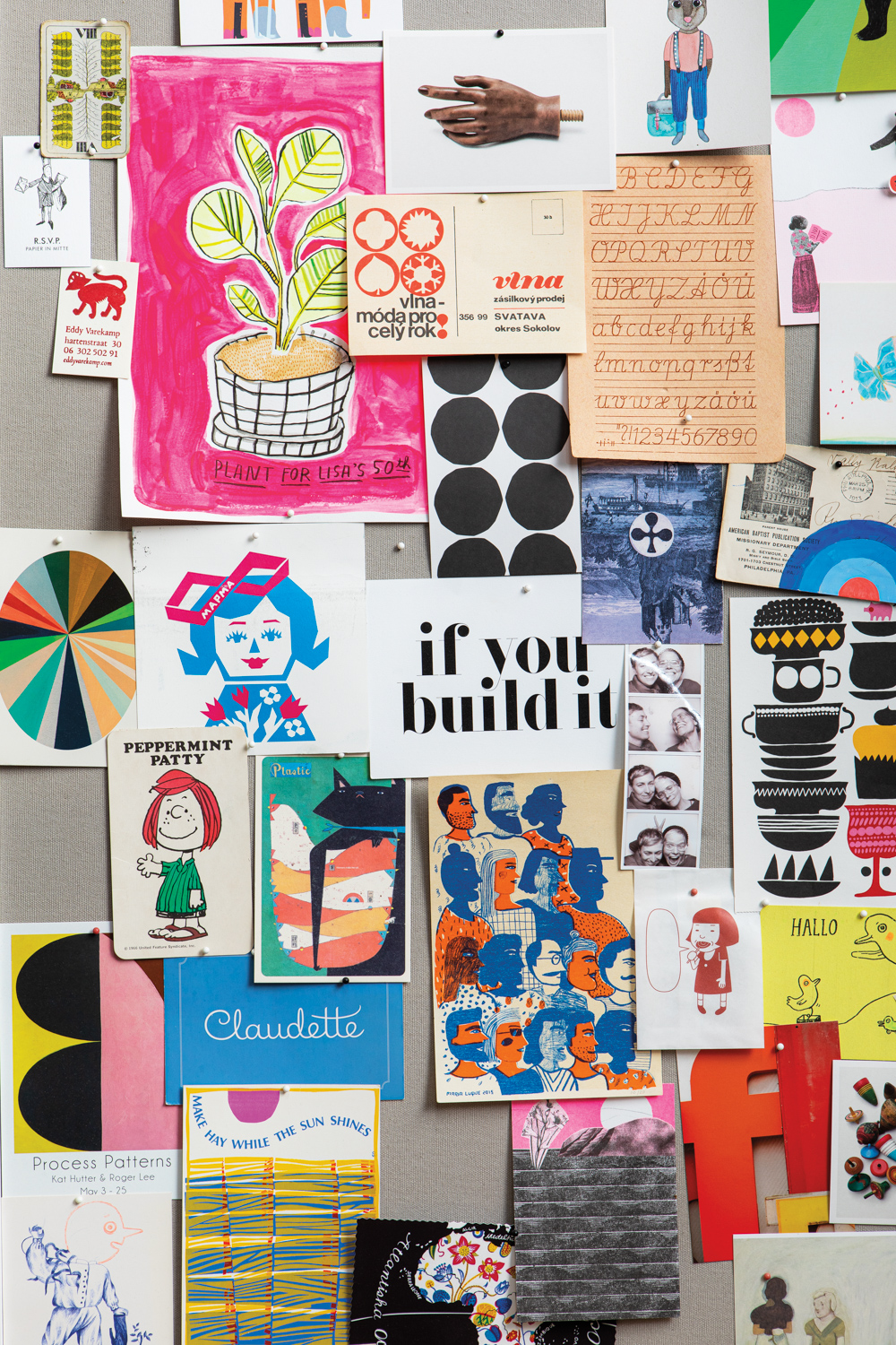 An inspiration board holds color pieces of paper.