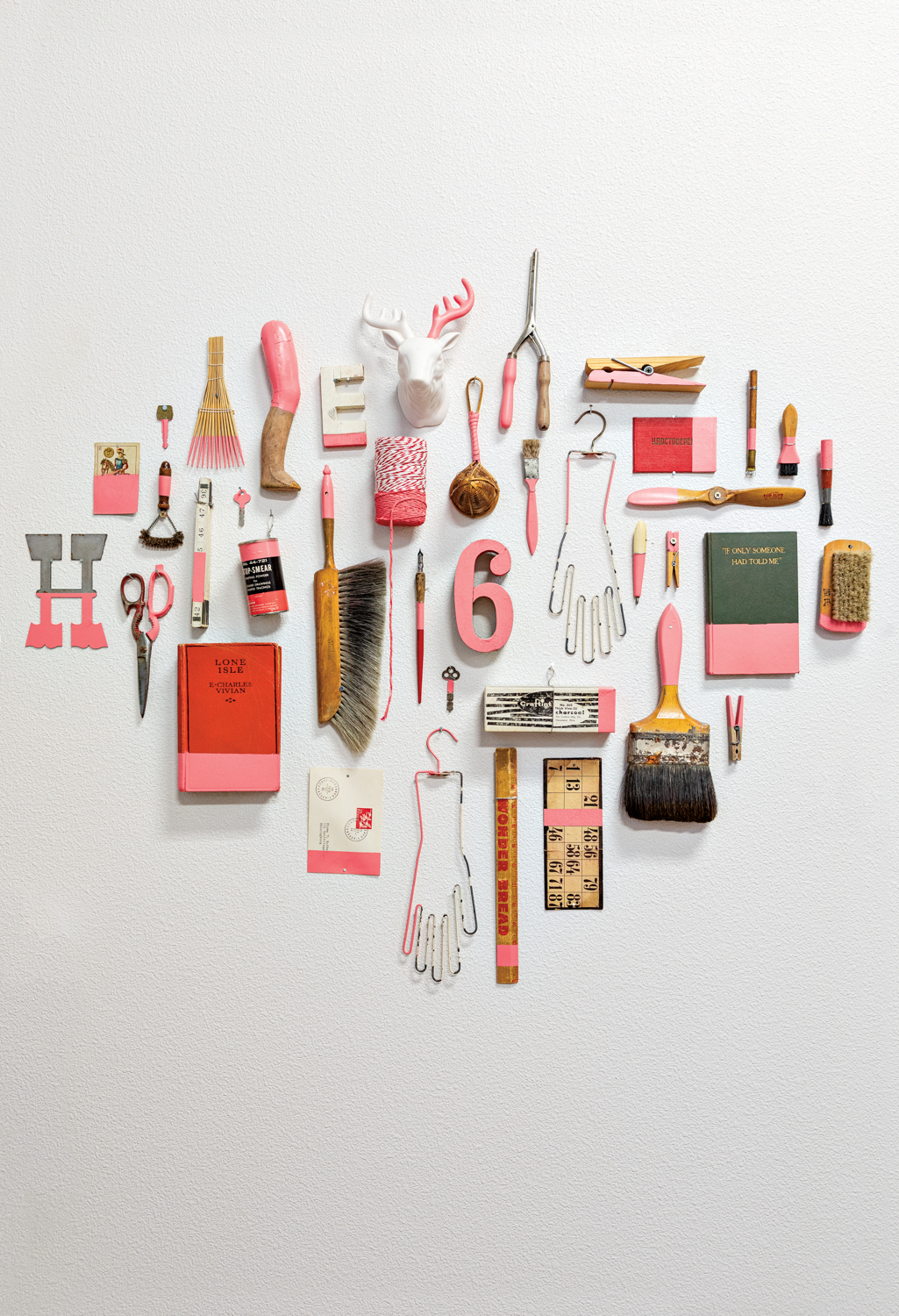 A collection of pink-hued items hangs on the wall of Congdon's studio.