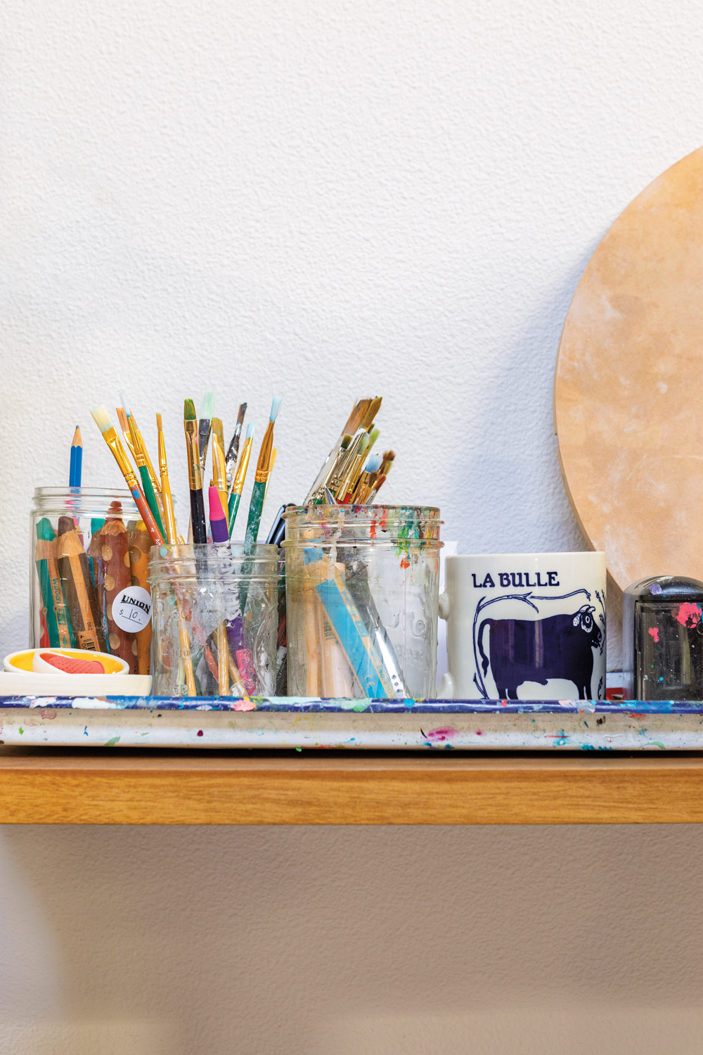 Paintbrushes in Lisa Congdon's studio