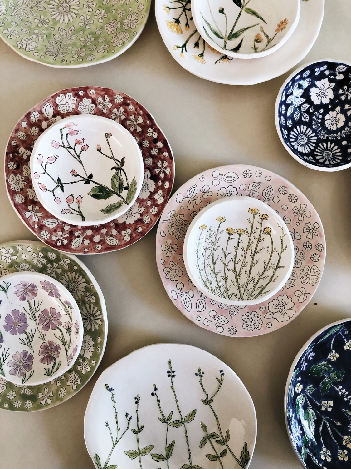 Dorotea Ceramics' colorful plates embellished with flowers.