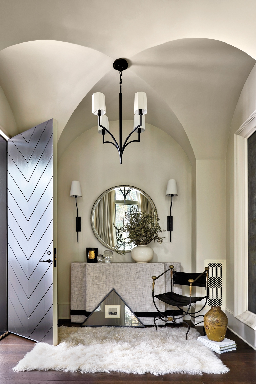 Entryway with arched ceiling details...