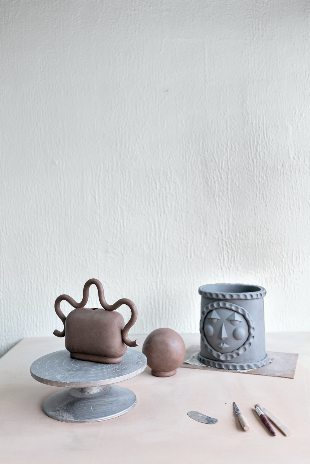 Unfired ceramic works on a table