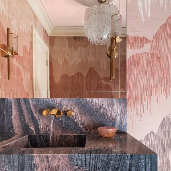 Take A Spin Around The Color Wheel In This Vibrant Houston Gem powder room with richly veined marble and complementary wallpaper