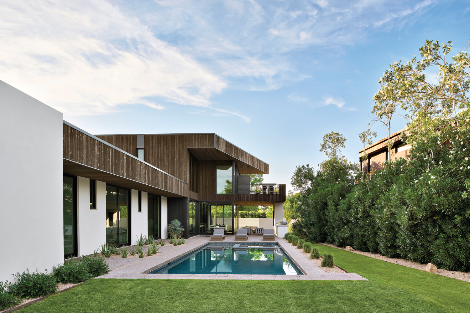 A modern home with a backyard pool.