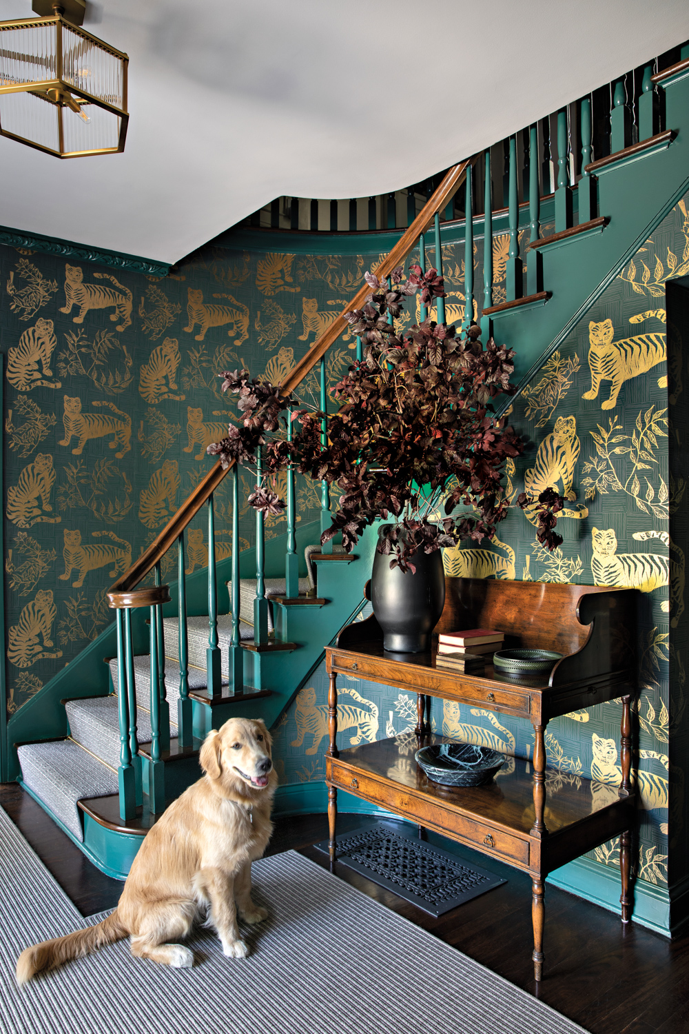 entryway staircase with metallic green...