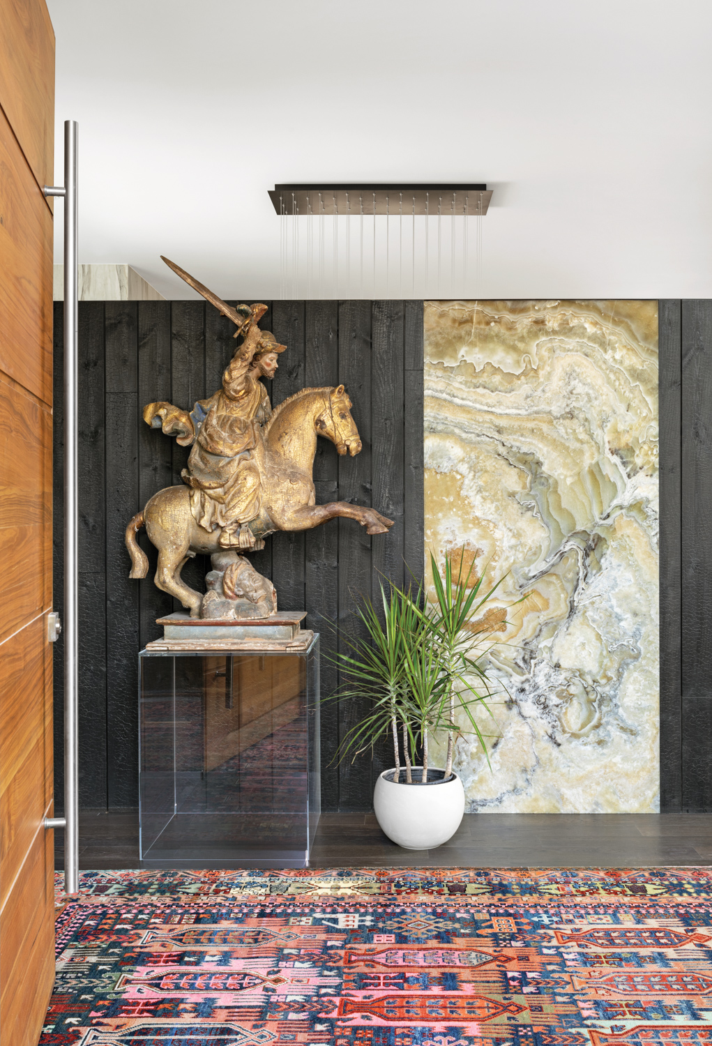 entryway with equestrian statue set...