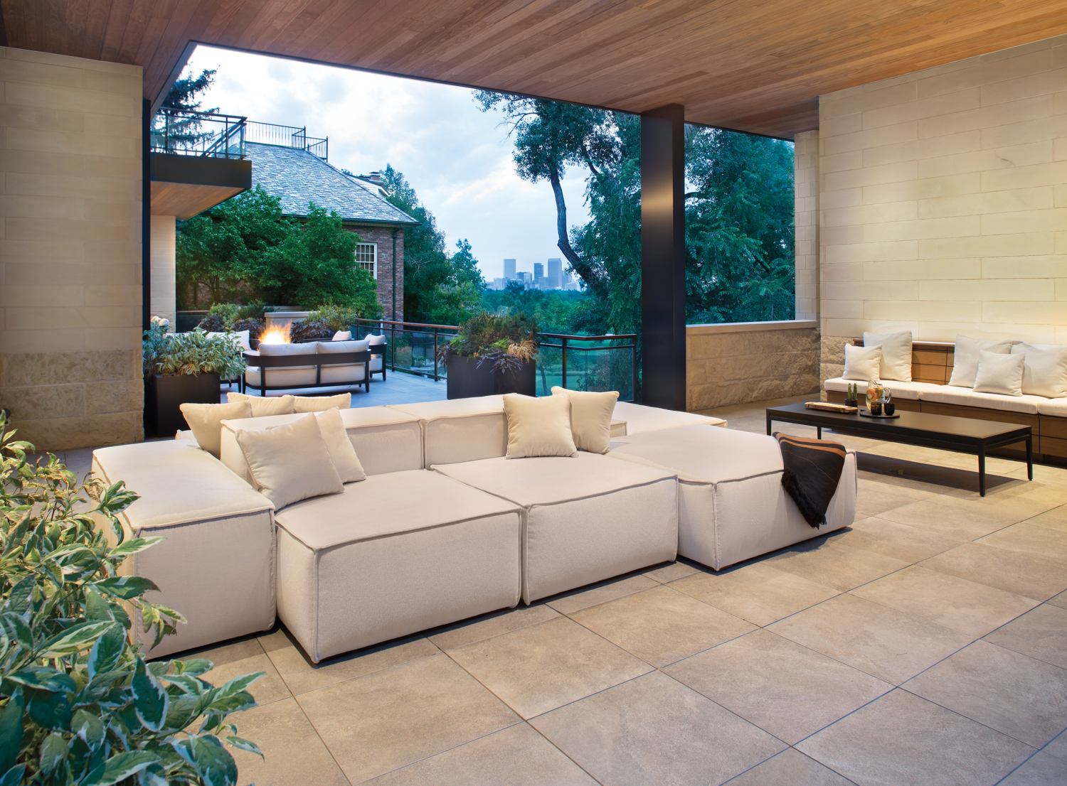 covered outdoor lounge space with...