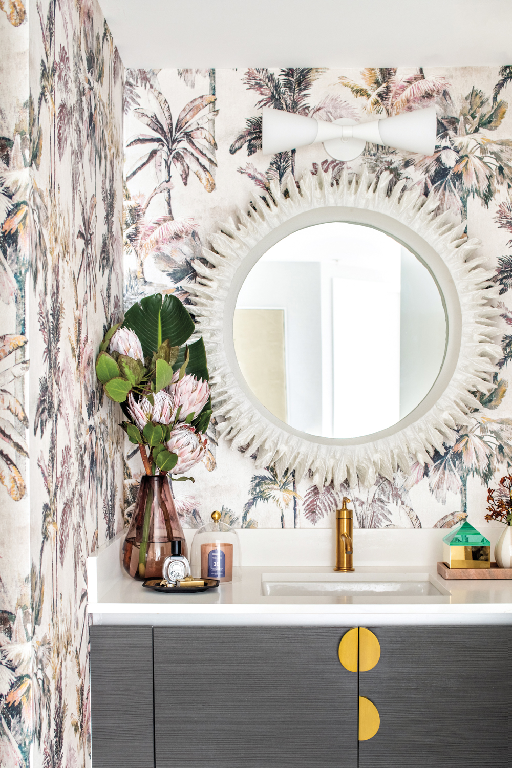 powder room with tropical-print wallcovering...