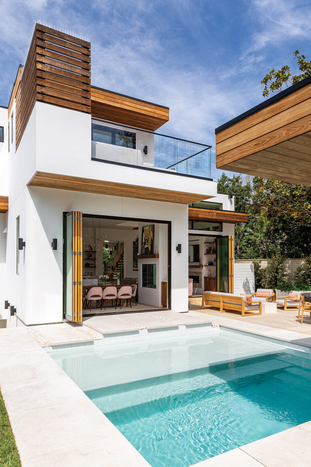 Large bifold doors connect the...