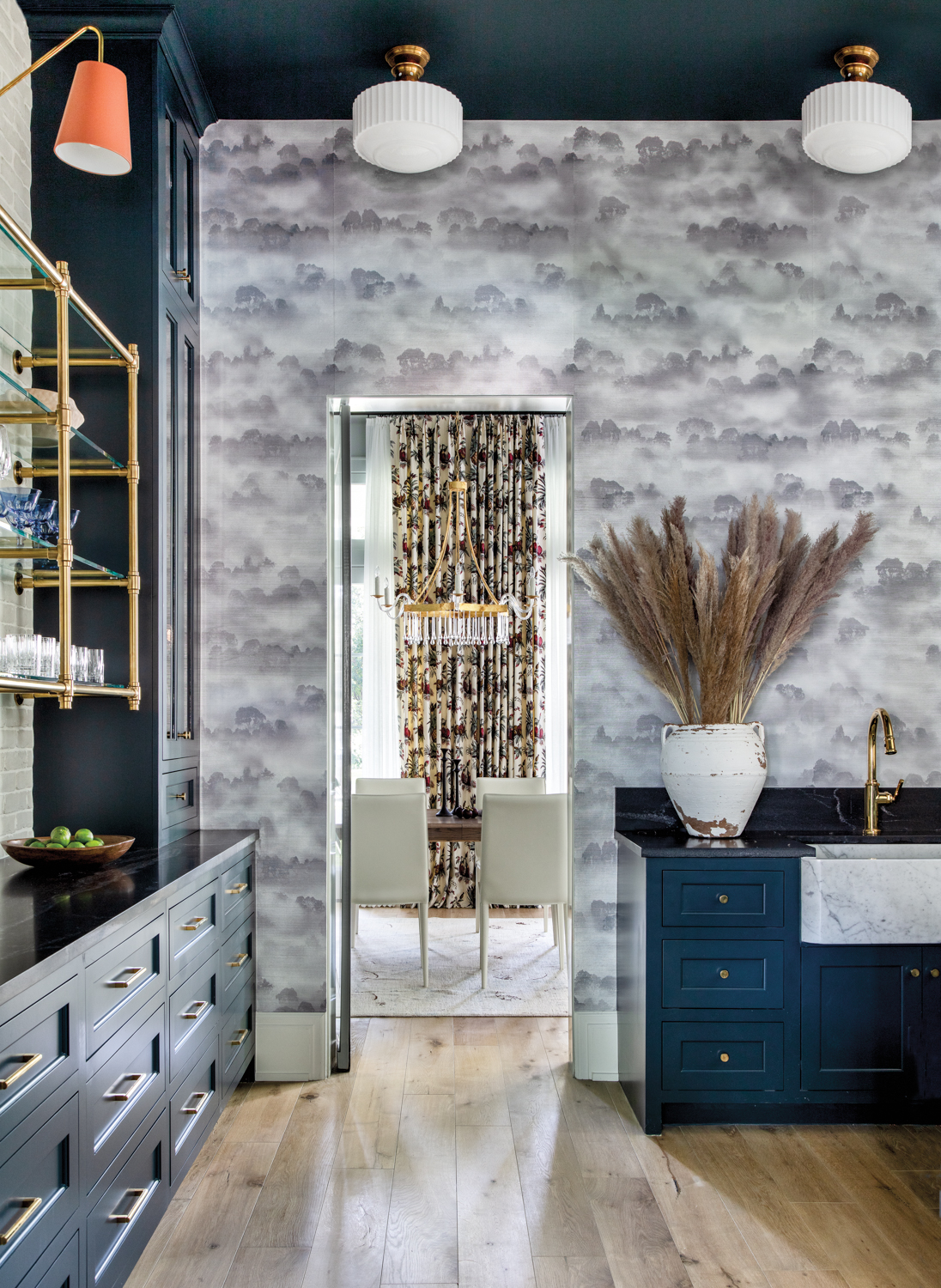 bar featuring patterned wallpaper and...