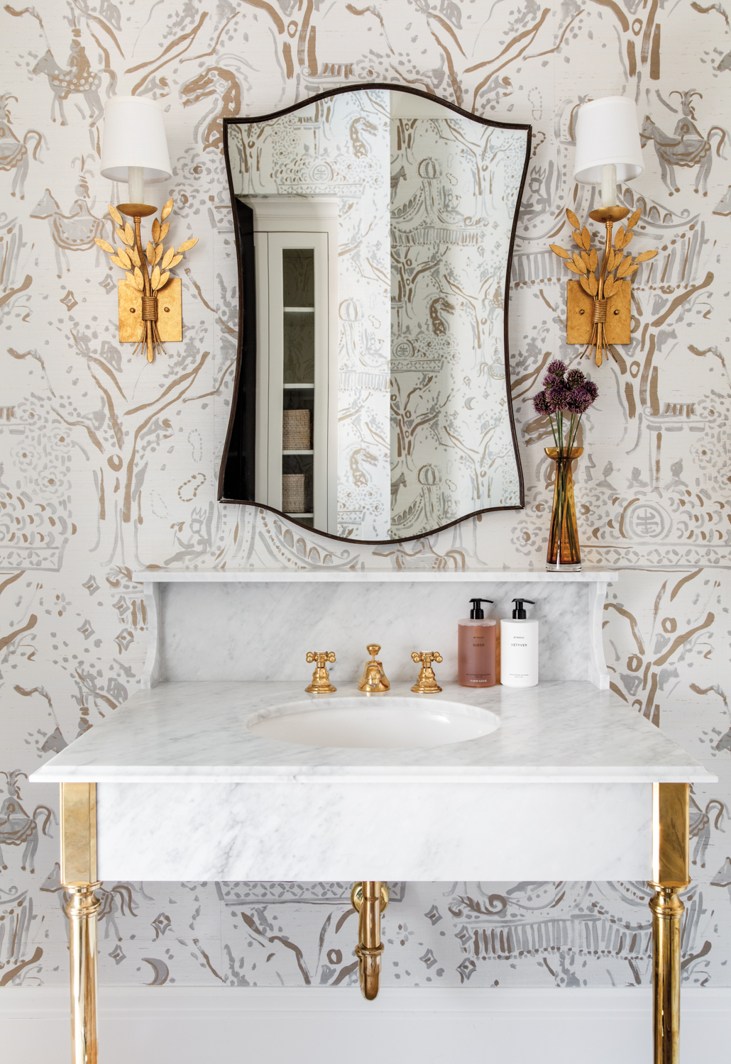 powder bathroom with patterned wallpaper...
