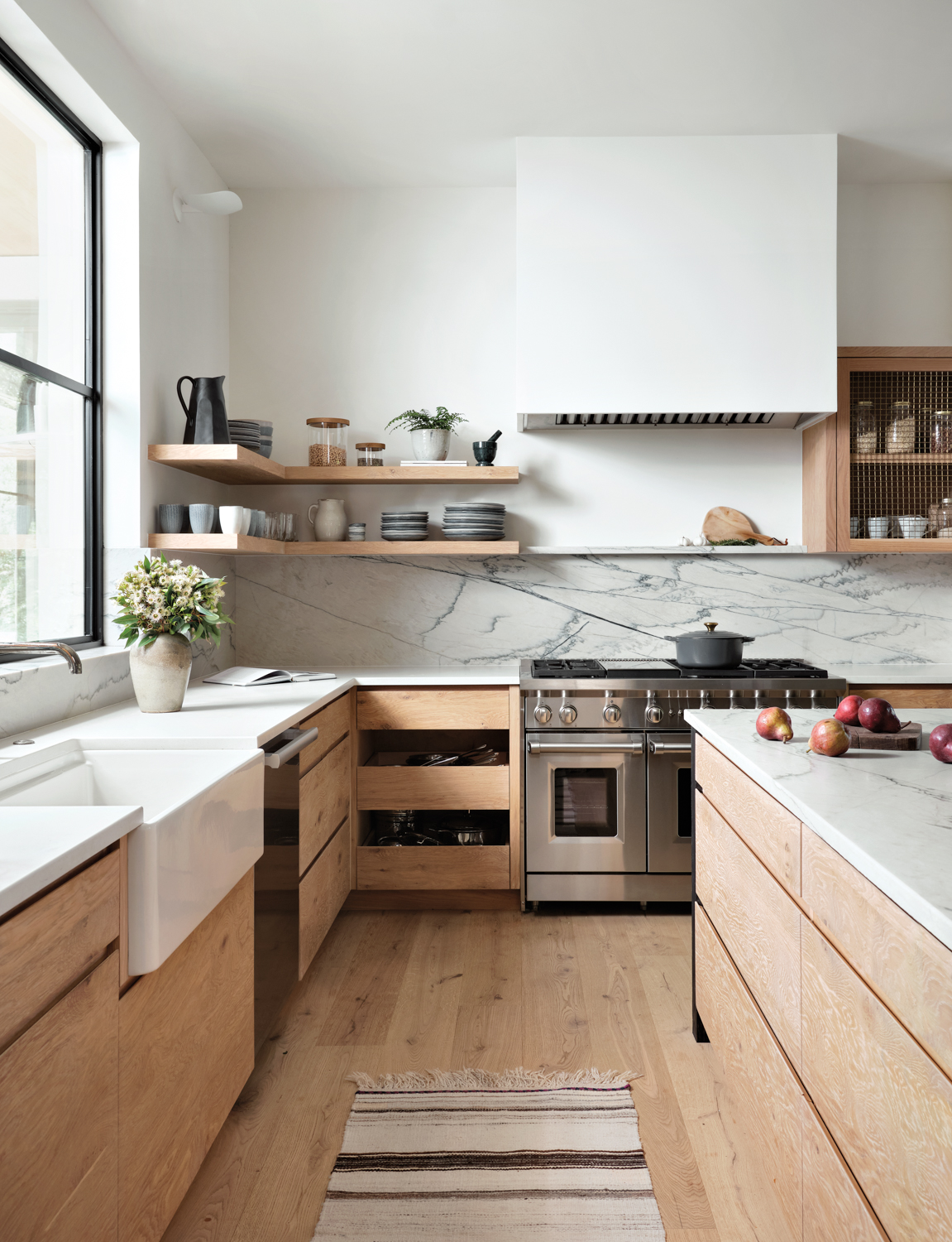 kitchen with open shelving and quartzite counters