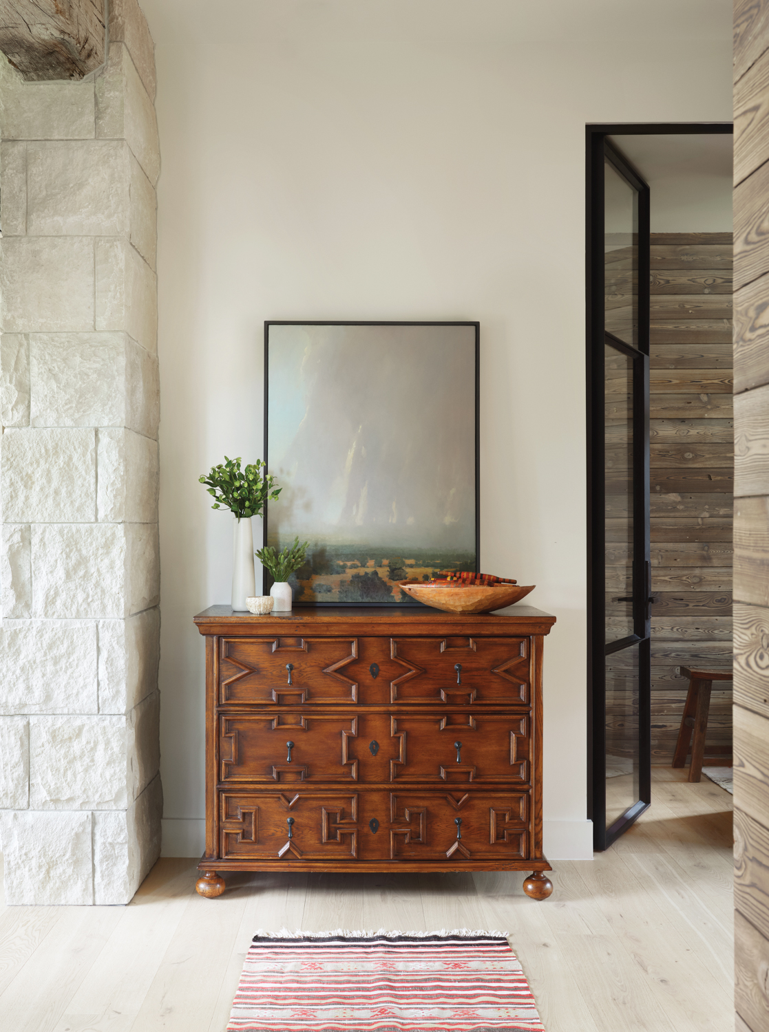 entry featuring an antique chest...