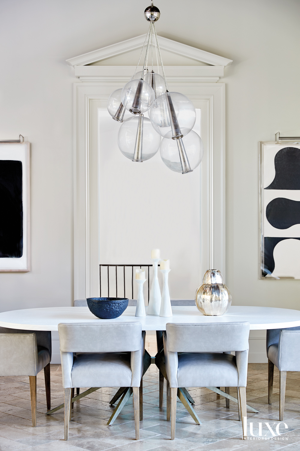 White dining room with oval...